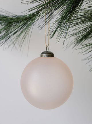 Chic 4-inch assorted vintage rose glass ornament by CG Hunter, showcasing a matte finish, delicately hanging from pine, ideal for adding sophistication to seasonal celebrations.