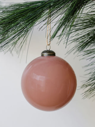 A lovely vintage rose glass ornament, 4 inches in diameter, with a soft finish, enhancing seasonal decorations as part of the exquisite collection by CG Hunter.