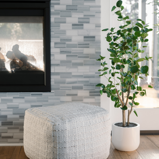 Elegantly styled CG Hunter 4' Faux Potted Eucalyptus Tree in a contemporary living room setting, complemented by a chic white pot.