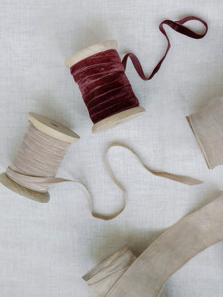 Chic collection of hand-dyed velvet ribbons from CG Hunter, highlighting deep crimson and soft neutral shades, ideal for elegant crafting and styling. Hand Dyed Velvet Ribbon 10 Yards Per Spool – Set of 2.