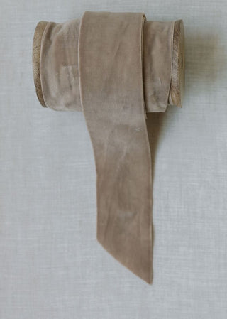 Sophisticated hand-dyed velvet ribbon by CG Hunter, 10 yards per spool, featuring a soft taupe color that enhances home décor with timeless elegance.