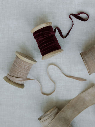 Close-up of rich hand-dyed velvet ribbons in burgundy and soft taupe, perfect for elegant décor, by CG Hunter.