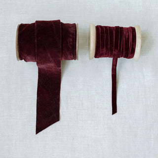 Luxurious deep burgundy velvet ribbon spools by CG Hunter, emphasizing plush texture and rich color suitable for sophisticated gift wrapping and home accents. Hand Dyed Velvet Ribbon 10 Yards Per Spool – Set of 2.