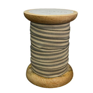 Elegant wooden spool of CG Hunter Grosgrain Ribbon in White and Grey, showcasing its quality and versatility for high-end crafting and decor.