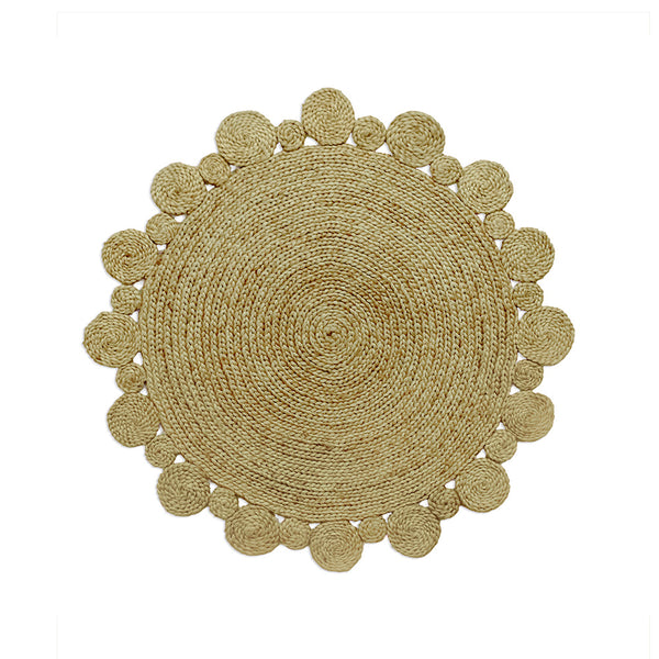 A round, beige-colored jute rug with scalloped edges and various circular design elements, handcrafted and displayed against a white background.
