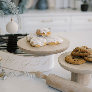 Charlotte Wood Serving Pedestal by CG Hunter, featuring delectable cookies displayed on a chic wooden pedestal, epitomizing luxury entertaining.