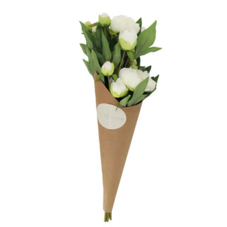 Bouquet of white flowers wrapped in brown paper with a label on a white background