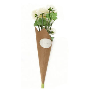 Bouquet of white flowers in a brown paper cone on a white background