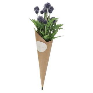 Faux plant in a cardboard cone on a white background