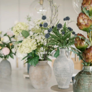 Vases with flowers on a table