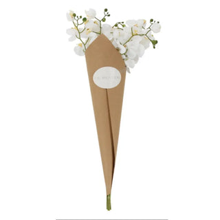 Floral arrangement in a brown paper cone with a white label on a white background
