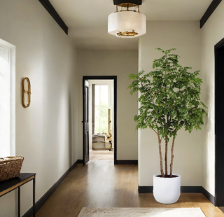 Luxurious 7' Faux Potted Sumac Tree by CG Hunter displayed in a stylish hallway, enhancing the sophisticated ambiance of the interior space.