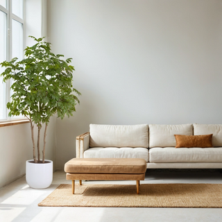 Luxurious living room featuring CG Hunter 7' Faux Potted Sumac Tree beside a modern sofa, showcasing a sophisticated and inviting atmosphere.