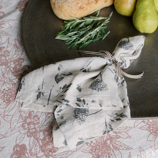 Refined table setting featuring a linen napkin elegantly tied with Grosgrain Ribbon in Cream and Black by CG Hunter, perfect for adding a touch of luxury to dining.