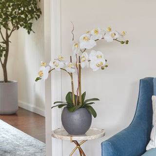 Luxurious lifelike artificial White Double Stem Orchid arrangement by CG Hunter in a modern grey pot, elegantly displayed in a chic interior setting.