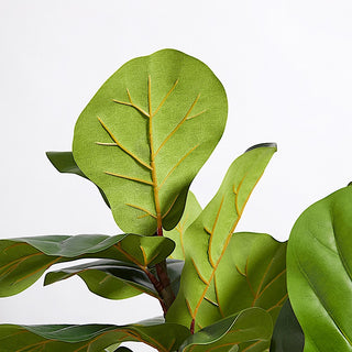 Close-up of the realistic leaves of the Artificial Fiddle Leaf Fig Tree by CG Hunter, highlighting intricate details and natural textures that elevate interior aesthetics.