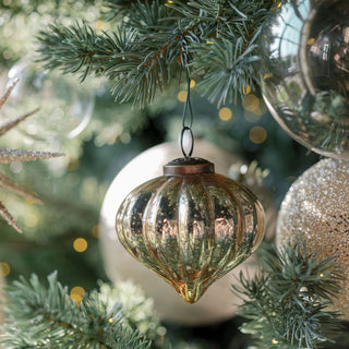 Elegant 4" Beaded Cream Glass Ornament by CG Hunter, beautifully displayed on a festive tree showcasing its shine and charm.