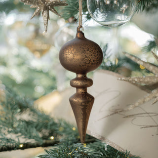 Richly detailed bronze glass finial ornament dangles elegantly on a festive tree, part of CG Hunter's assorted neutral palette collection.