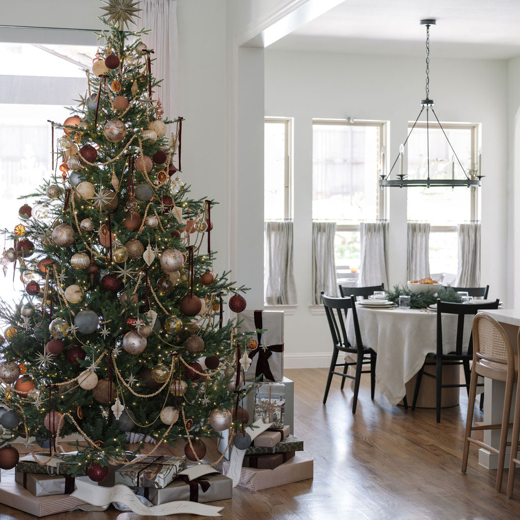 Beautiful tree with 4" Handblown Gold Etched Glass Ornament on a timeless holiday tree