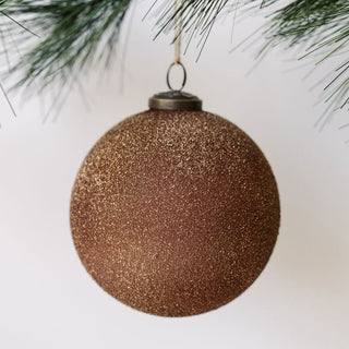 Luxurious 5-inch textured cinnamon glass ornament by CG Hunter, featuring a shimmering finish, perfect for adding elegance to holiday decor.