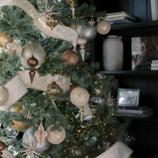 Luxury Christmas tree adorned with exquisite handcrafted 4" Beaded Antique Bronze Glass Ornaments by CG Hunter, showcasing a blend of sparkling glass and intricate detailing.