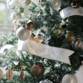 Elegant holiday decor featuring stunning 4" Beaded Antique Bronze Glass Ornaments by CG Hunter, beautifully arranged on a decorated Christmas tree with shimmering embellishments.