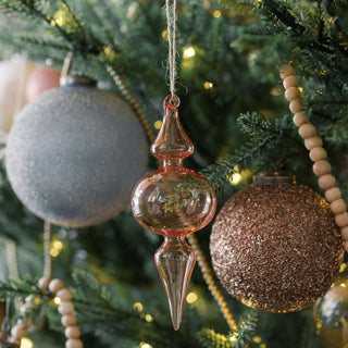 Elegant 4" Beaded Antique Bronze Glass Ornament by CG Hunter, artistically positioned among other ornaments on a festive tree, highlighting its unique antique design.