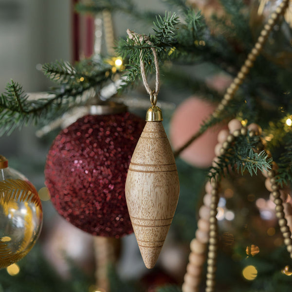 4" Beaded Bordeaux Glass Ornament  in background with Wooden Ornaments