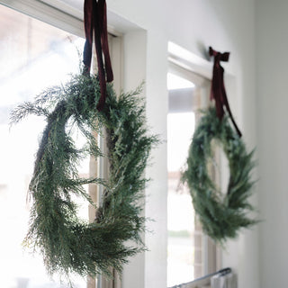 Gorgeous hand-dyed velvet ribbons adorning a lush evergreen wreath, enhancing home décor with elegance, featuring CG Hunter’s artisan quality – Hand Dyed Velvet Ribbon 10 Yards Per Spool.