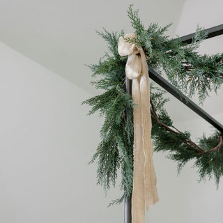Elegant wreath adorned with hand dyed velvet ribbon, adding a luxurious touch to holiday decor, perfect for enhancing seasonal aesthetics with CG Hunter's Hand Dyed Velvet Ribbon 10 Yards Per Spool – Set of 2.