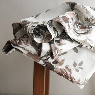 Luxury CG Hunter Eggplant and Grey Roses Tablecloth elegantly displayed with floral patterns, showcasing its artisanal beauty and sophistication.