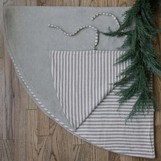 Luxury Ticking Stripe Reversible Tree Skirt by CG Hunter showcasing its elegant design with soft cotton ticking stripe fabric and natural wool, perfect for enhancing your festive decor.