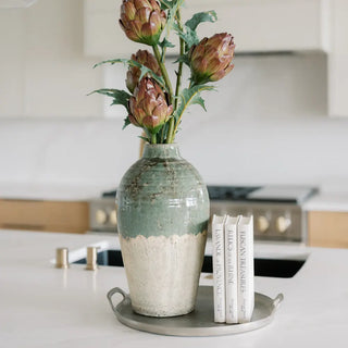 Decorative vase with flowers on a kitchen counter