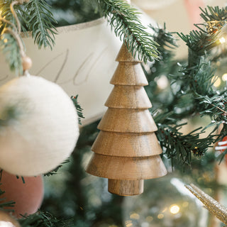 Stylish 5" Wooden Tree Christmas Ornament delicately suspended amidst holiday decorations, showcasing the handcrafted quality of CG Hunter's exquisite designs.