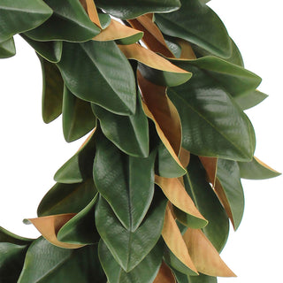 Detailed close-up of the 30" Faux Green Magnolia Leaf Wreath by CG Hunter, showcasing the rich texture and color contrast of the lush foliage.