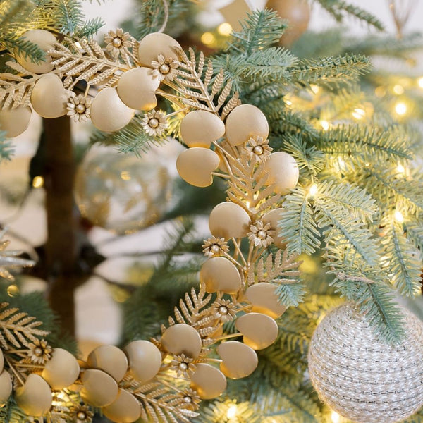 A beautiful display of the CG Hunter 12" Mixed Metal Wreath with Leaves and Berries Set, showcasing its warm tones amidst a tree. This mixed metal wreath fits perfectly into your 2025 Holiday and Fall Home Decor themes. Holiday Sale, New Arrival, Set: Set of 2.