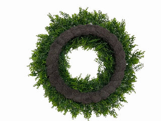 Green wreath with brown trim on a white background