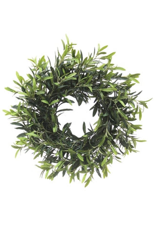 Green artificial wreath on a white background