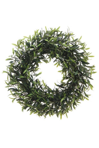 Green artificial wreath on a white background