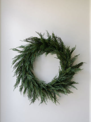 Sophisticated 30" Faux Evergreen Cedar Wreath from CG Hunter, featuring rich greenery ideal for enhancing festive decor with a touch of luxury.
