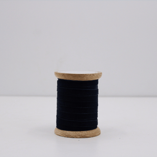 Narrow Hand Dyed Velvet Ribbon in Dark Blue by CG Hunter, elegantly wound on a handcrafted wooden spool, perfect for luxurious decor and crafts.