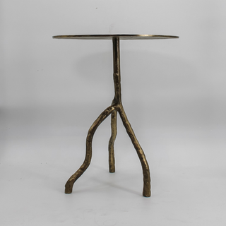 Elegant view of the CG Hunter Handcrafted Antique Brass Aluminum Accent Table highlighting its unique branch-like base and sophisticated design.