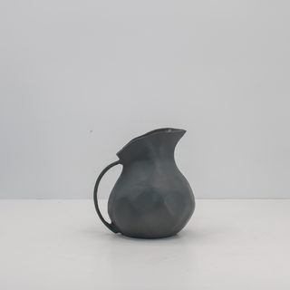 Elegant 8.5" Warm Grey Aluminum Vase with Handle by CG Hunter, showcasing a unique organic shape, perfect for sophisticated home decor.