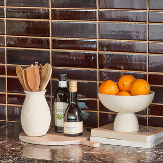 Functional and stylish Charlotte Serving Bowl by CG Hunter, holding fresh oranges, set against a contemporary kitchen backdrop with earthy wooden utensils.