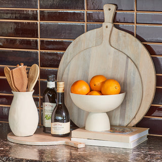 Charlotte Serving Bowl by CG Hunter, showcasing eco-friendly materials against a stylish kitchen backdrop with wooden utensils and a rustic ambiance.