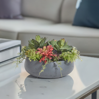 Chic round artificial succulent arrangement in a stylish gray planter by CG Hunter, combining lifelike faux succulents with a contemporary design, perfect for enhancing any luxurious space.