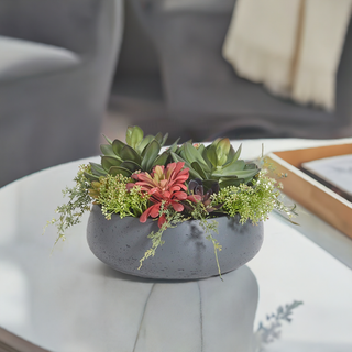 Elegant round artificial succulent arrangement presented in a sleek gray planter by CG Hunter, featuring vibrant faux succulent varieties ideal for sophisticated indoor or covered outdoor settings.