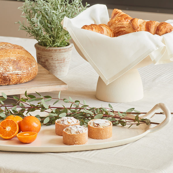 Wooden Board Holding Bread and Breakfast Desserts